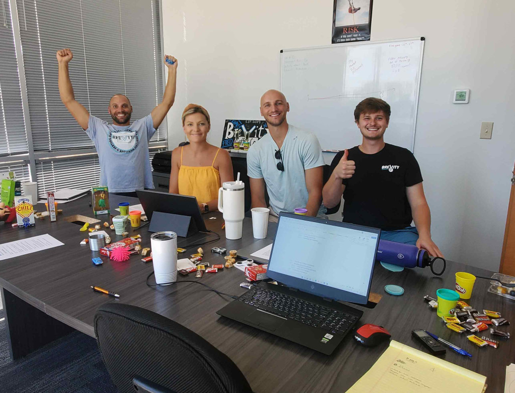 Clients celebrate finishing their Franchise Operations Manual with FranMan staff.